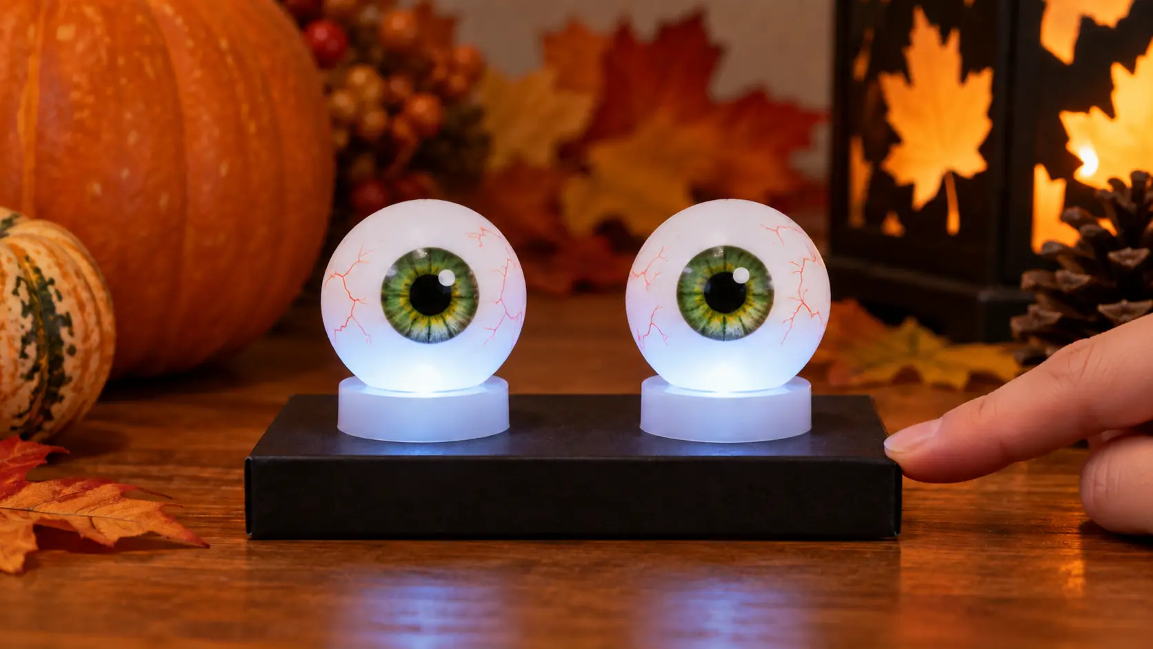 Fixer le duo sur un socle pour fabriquer Yeux lumineux Halloween avec balles de ping-pong et bougies LED