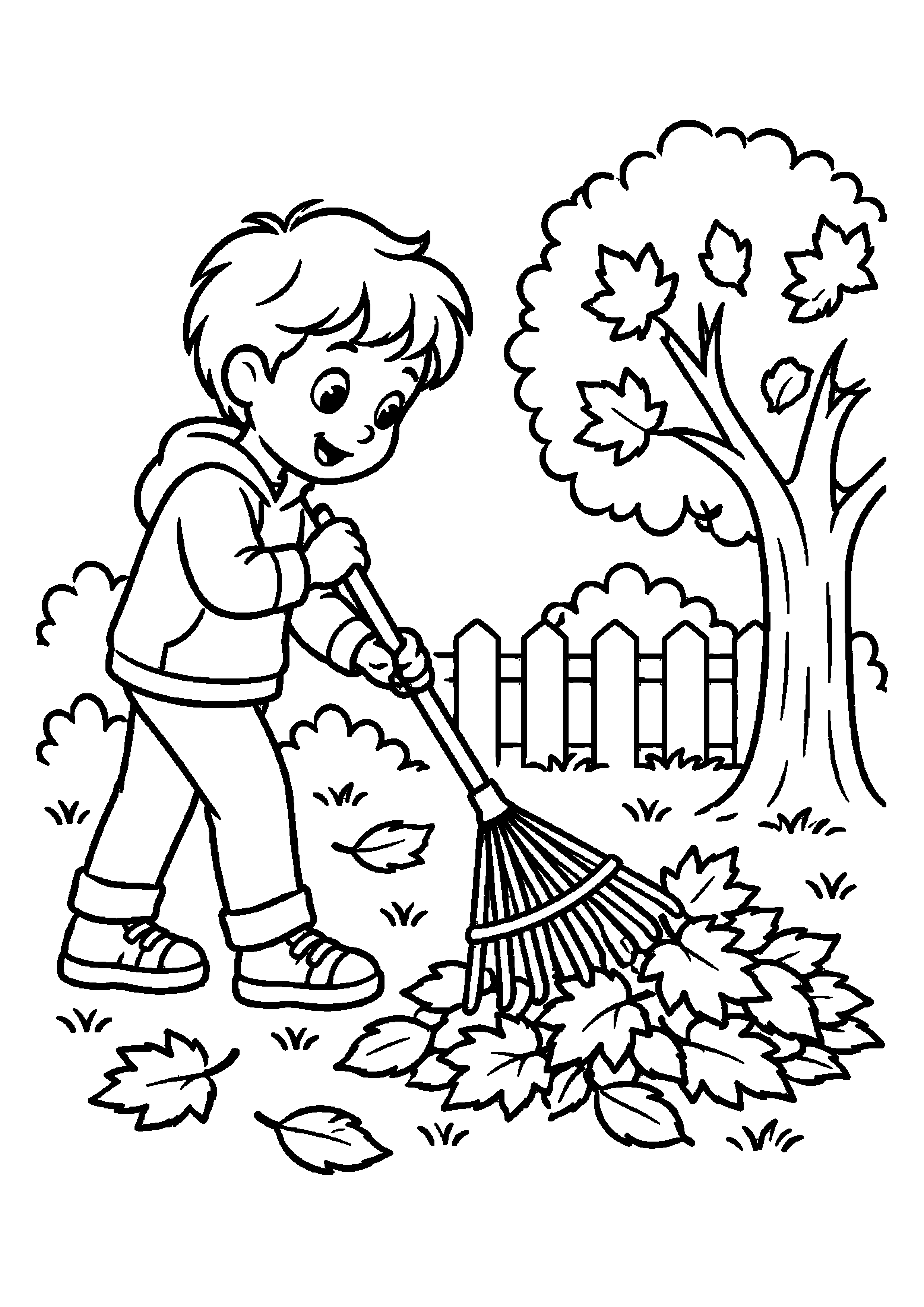 Enfant rassemblant des feuilles d'automne avec un râteau