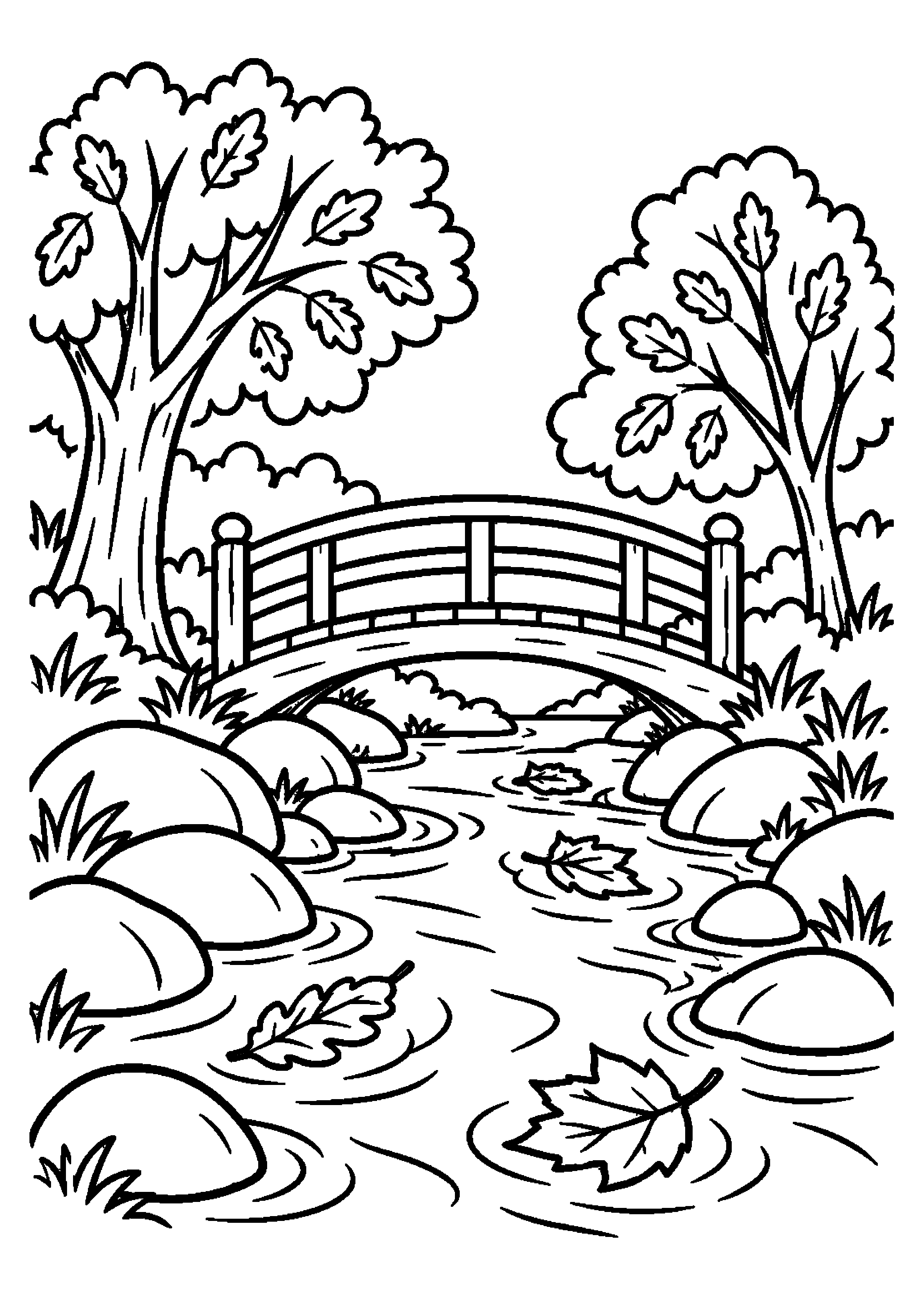 Ruisseau traversant une forêt d'automne sous un petit pont en bois
